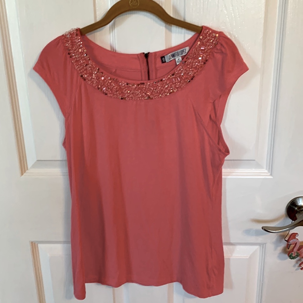 J LO top with sequins around the neck